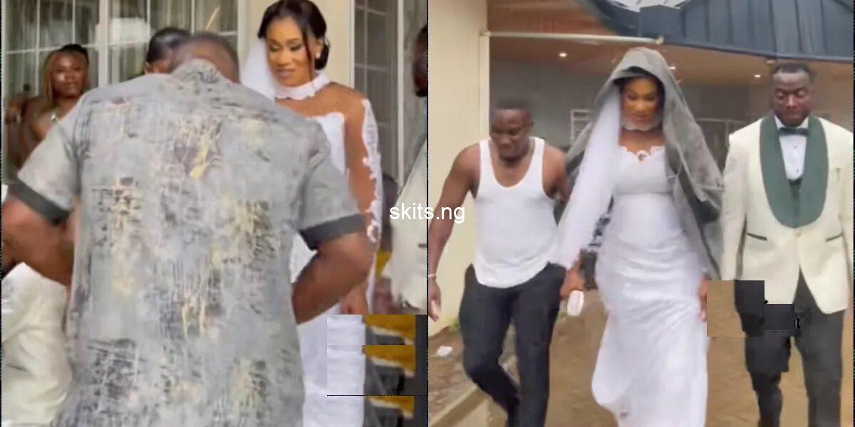 Mc hailed for removing his cloth to protect bride from rain