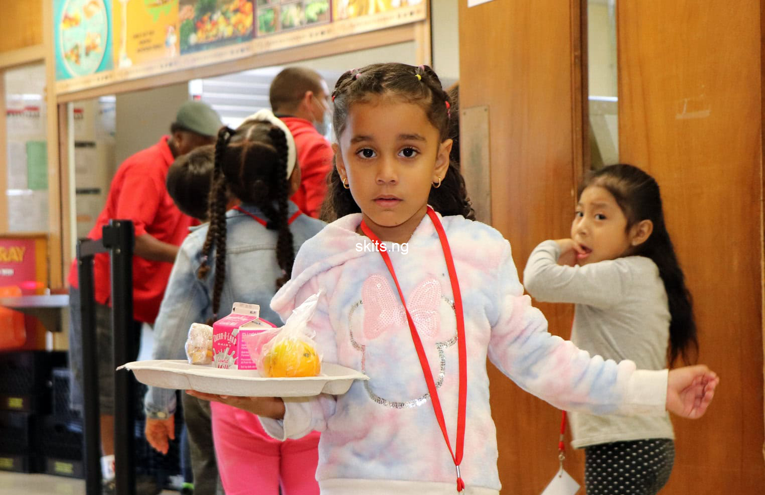 Sweet moment as university students surprise cleaner with foodstuffs photos