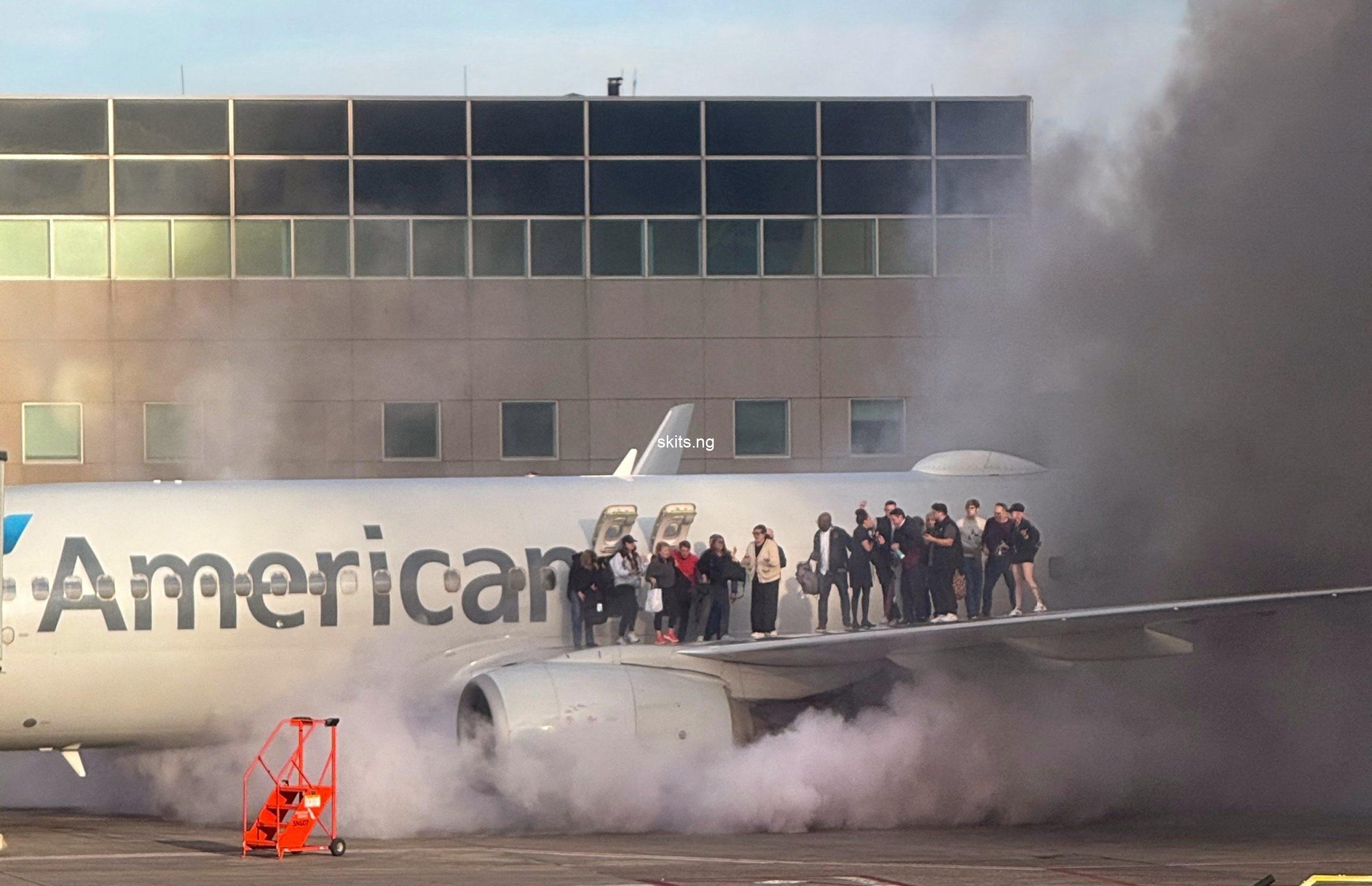 American airlines plane catches fire at denver airport 12 hospitalised with minor injuries video