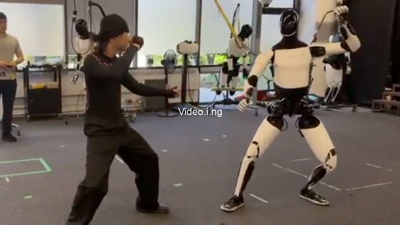 Elon musk releases video of tesla optimus robot learning martial arts and fighting human