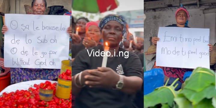 Ghana traders light candles display placards in honour of mohbad video