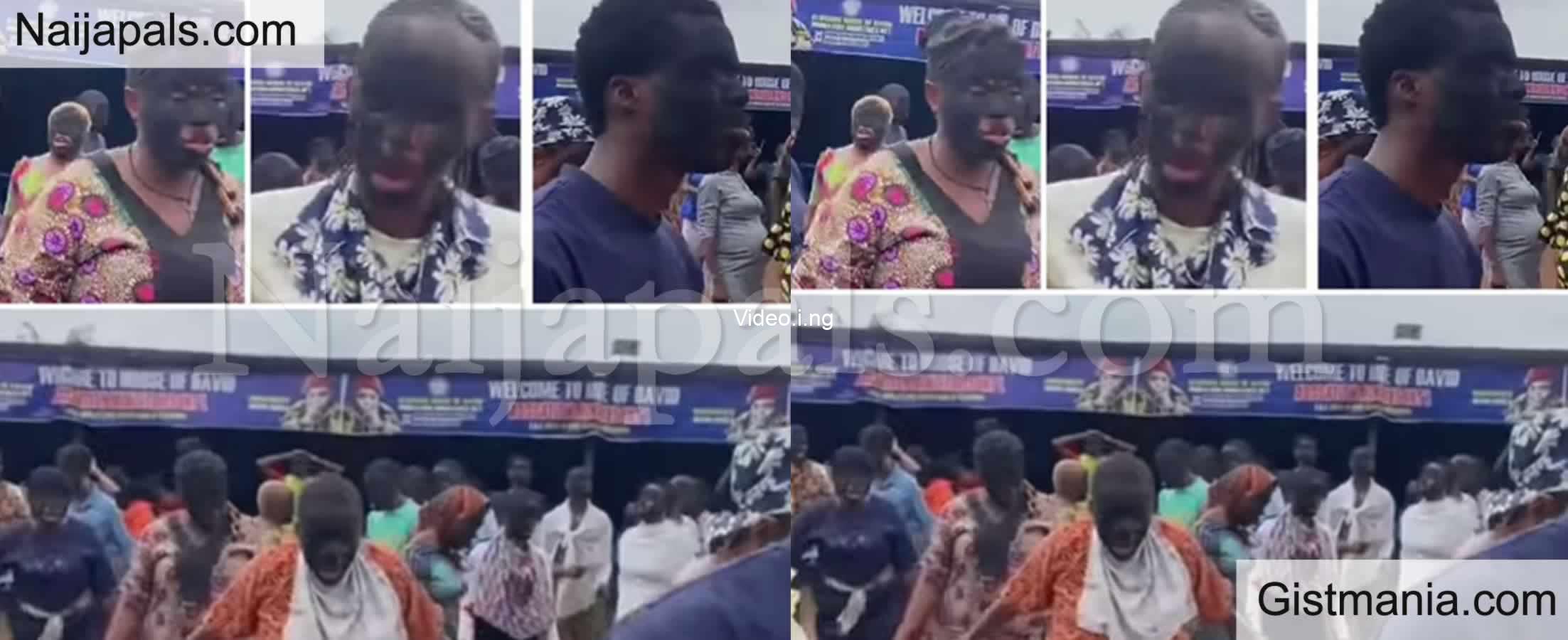 Church members cover their faces in charcoal as they pray during church program